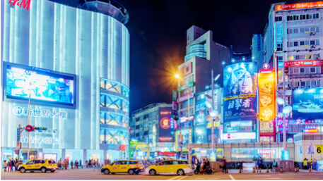 Private car and taxi on a busy street in central Taipei