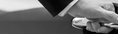 Driver about to open car door Chauffeur Service